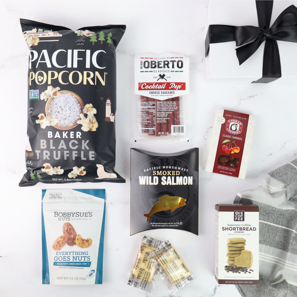 pacific northwest snack gift box with pacific popcorn, oberto cocktail pep, chukar cherries, smoked salmon, nuts, crackers and coffee shortbread cookies.