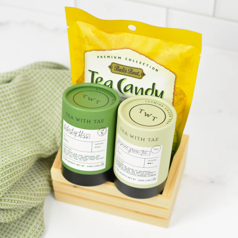 Two tea canisters with labels and a yellow package labeled 'Tea Candy' on a white background.