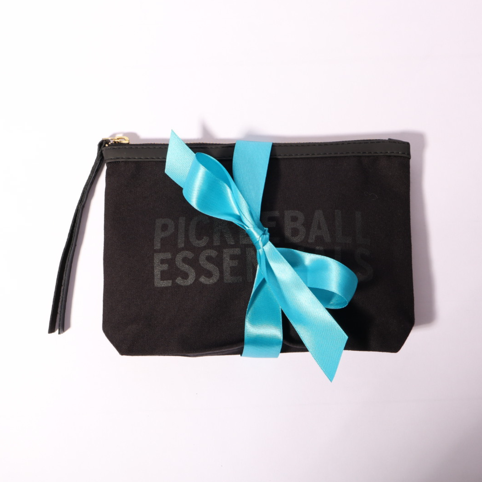 Stylish Pickleball Essentials Zipper Pouch, featuring a playful design that highlights its purpose. Perfect for organizing gear and accessories for pickleball enthusiasts, this pouch is a key component of the thoughtful pickleball gift for her.