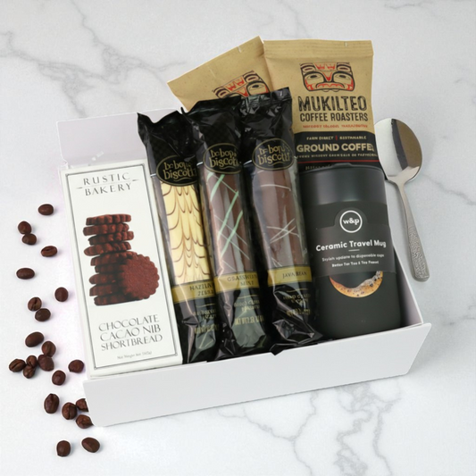 Coffee and snack gift set with travel tumbler, gourmet coffee, biscotti, and chocolate cookies.