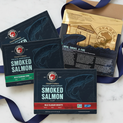 Collection of seabear smoked salmon gift set packages with branding on a marble surface