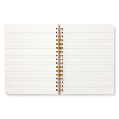 Open notebook with white pages and a gold spiral binding on a white background