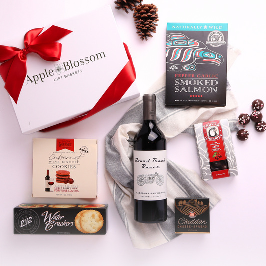 Taste of Washington wine and snack gift box featuring snacks made in the Pacific Northwest.  Mark ryan wine, cheese, crackers, chocolate cherries and smoked salmon.
