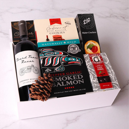 Taste of Washington wine and snack gift box featuring snacks made in the Pacific Northwest.  Mark ryan wine, cheese, crackers, chocolate cherries and smoked salmon.