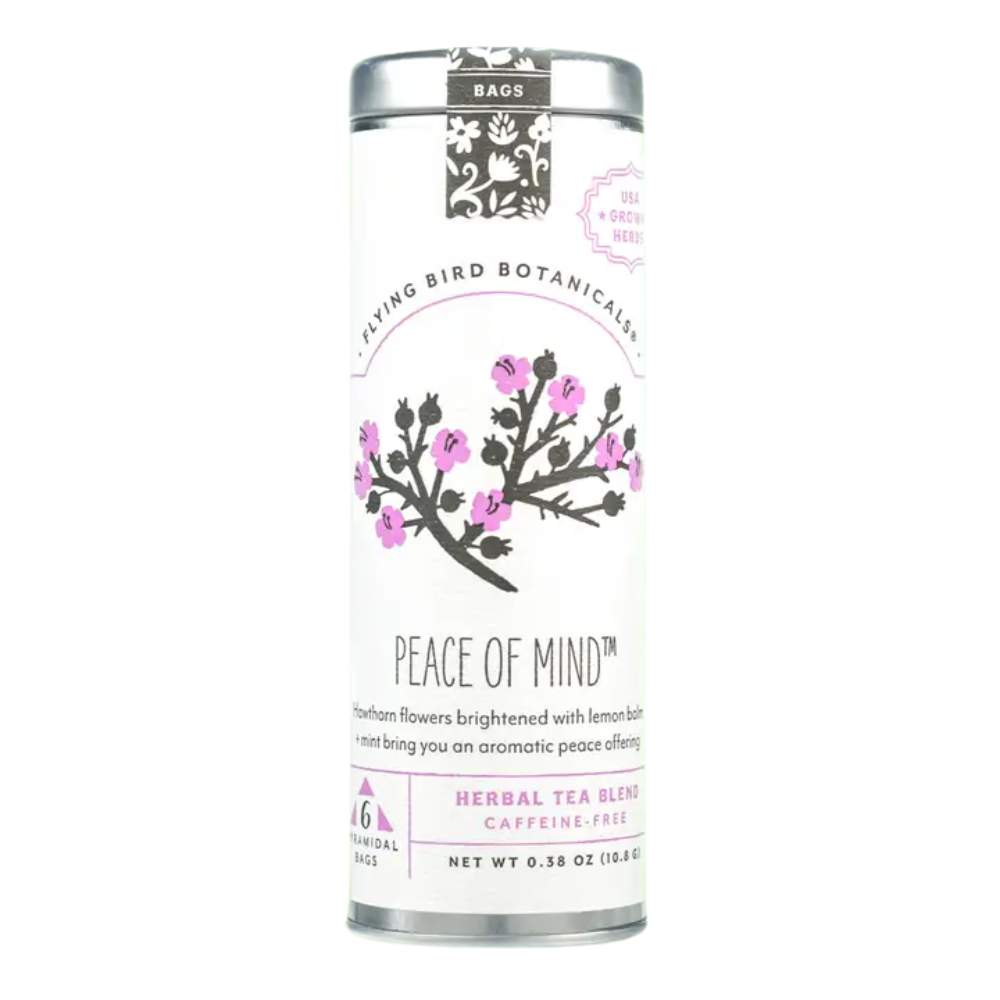 Flying Bird Botanicals Peace of Mind organic herbal tea in a decorative tin with pink botanical floral artwork, made in Bellingham, Washington.