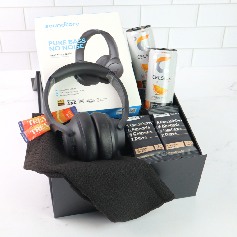 The Recharge gift box with wireless headphones, protien bars and gourmet treats in a black gift box