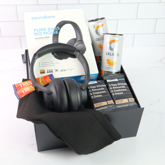 The Recharge gift box with wireless headphones, protien bars and gourmet treats in a black gift box