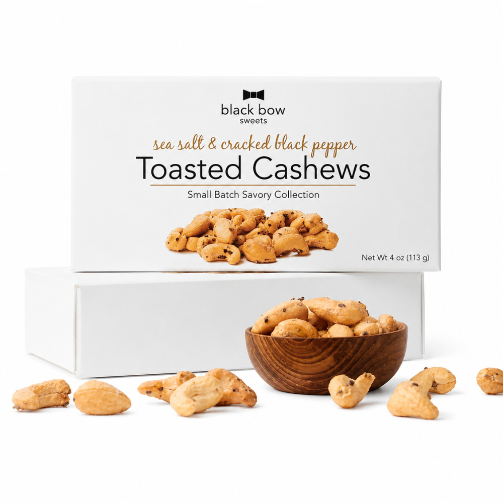 4oz white box of toasted cashews by black bow sweets.