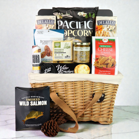 Washington picnic basket filled with gourmet snacks including popcorn, salami, crackers, cheese, and artisan treats, arranged in a classic lidded wicker picnic basket