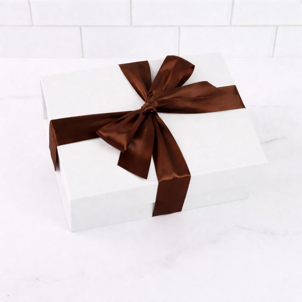 white gourmet gift box with brown ribbon