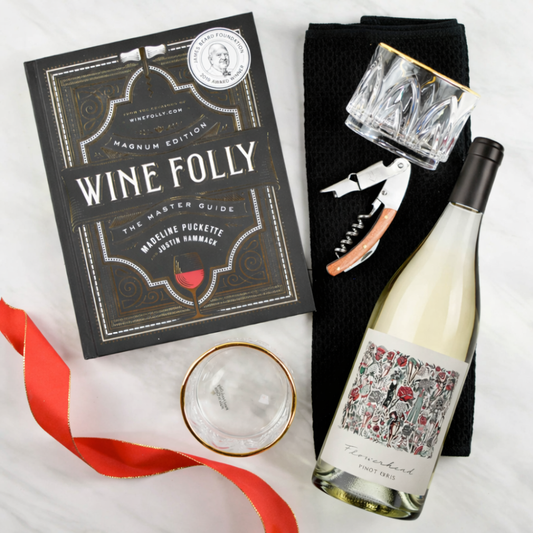 Wine bottle, 'Wine Folly' book, glasses, and corkscrew on a white background with mark ryan pinot gris
